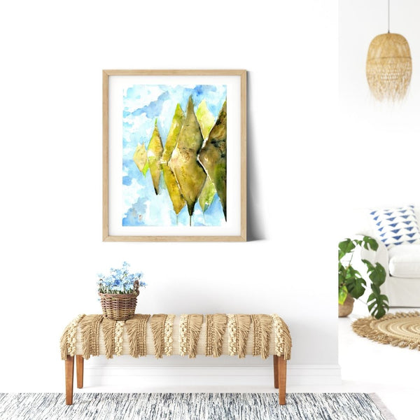 Sky Mountain - Patahuasi Stone Forest Conical Green Mountain wall art watercolor Canvas Print.  Ethereal stone forest mountain landscape painting watercolor canvas print. Stylized, blue sky and mossy hills visual art piece creates an atmospheric landscape canvas print hanging on white walls above a bench.  Archival print of original watercolor painting of illustrator and artist Patricia Jacques.Great for minimalist home decor, children’s room or colorless spaces. Exudes magical realism and playfulness.