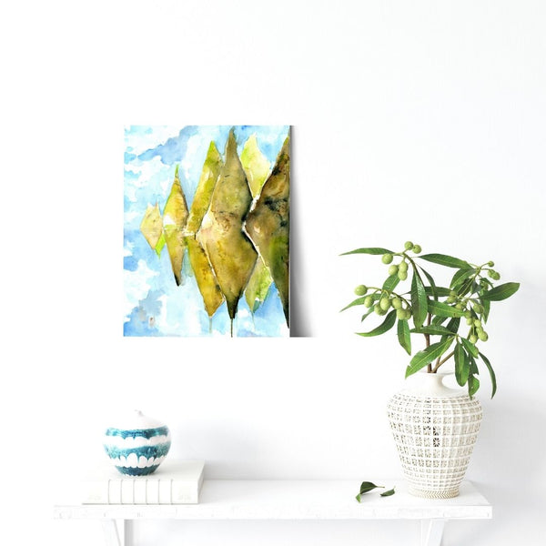 Sky Mountain - Patahuasi Stone Forest Conical Green Mountain wall art watercolor Canvas Print.  Ethereal stone forest mountain landscape painting watercolor canvas print. Stylized, blue sky and mossy hills visual art piece creates an atmospheric landscape canvas print hanging on white walls above a bench.  Archival canvas print of original watercolor painting of illustrator and artist Patricia Jacques. Exudes magical realism and playfulness. Great for a variety of home decor.