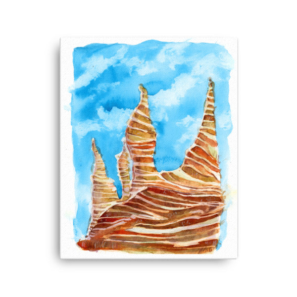 16x20 inches Psychedelic Sedona Red Rocks Southwestern wall art watercolor Canvas Print. Stylized American Southwest watercolor canvas print. Visual art piece streaked with red stripes, softened with earthy greens pine trees and blue sky, against a white wall.  Archival print of original high desert watercolor painting of illustrator and artist Patricia Jacques.  Punch of color for for minimalist home decor, a children’s room or a colorless space. Exudes magical realism and playfulness.